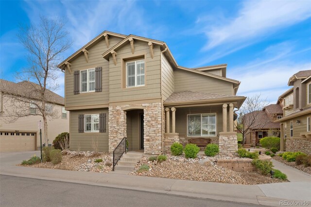 10618 Clearview Ln, Highlands Ranch, CO 80126 - craftsman house with stone siding, covered porch, a garage, and concrete driveway