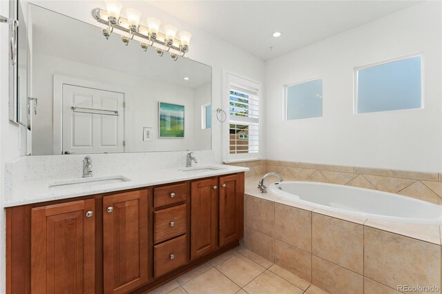 10618 Clearview Ln, Highlands Ranch, CO 80126 - bathroom featuring a garden tub, double vanity, and tile patterned floors