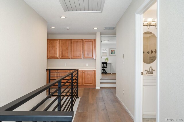 10618 Clearview Ln, Highlands Ranch, CO 80126 - hallway featuring light wood finished floors and recessed lighting