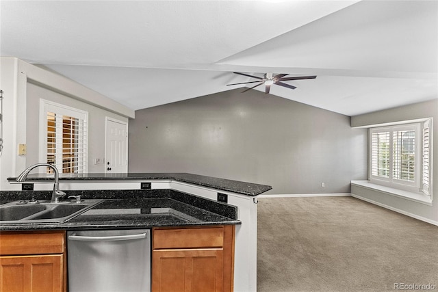 kitchen with ceiling fan, stainless steel dishwasher, light colored carpet, vaulted ceiling, and sink