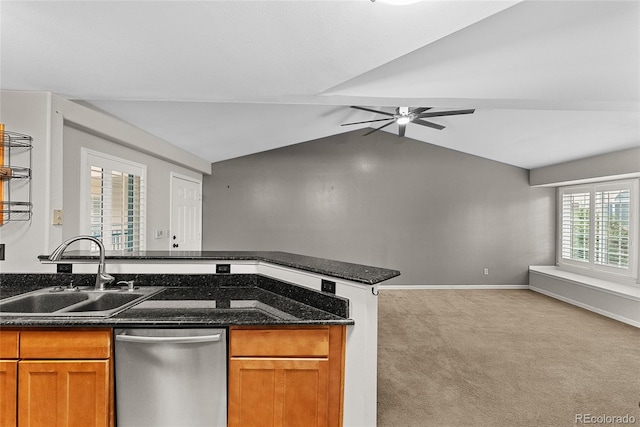 kitchen featuring lofted ceiling, dishwasher, ceiling fan, light carpet, and sink