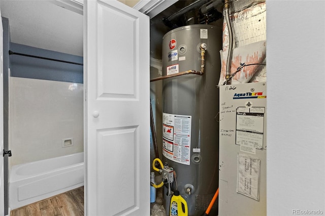 utility room with water heater