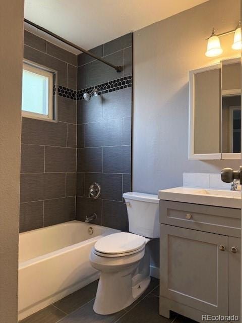 10050 Holland Ct, Broomfield, CO 80021 - bathroom with tile patterned floors, vanity, and shower / bath combination