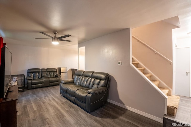 10050 Holland Ct, Broomfield, CO 80021 - living area featuring wood finished floors, ceiling fan, and stairs