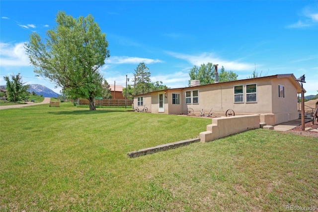 204 Walnut St, La Veta, CO 81055 - back of house with stucco siding and a mountain view