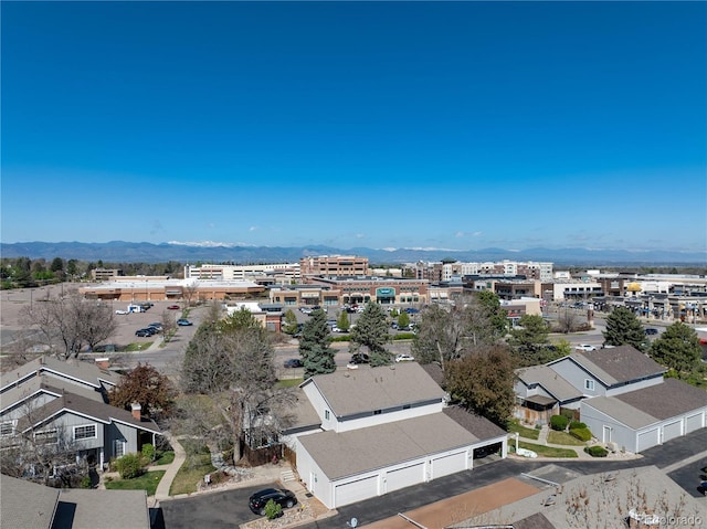birds eye view of property featuring a mountain view