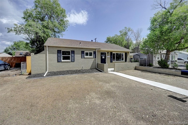 1216 Norwood Ave, Colorado Springs, CO 80905 - ranch-style house with brick siding and roof with shingles