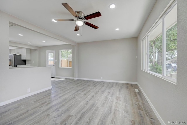 1216 Norwood Ave, Colorado Springs, CO 80905 - unfurnished living room with a ceiling fan, light wood-style floors, and recessed lighting