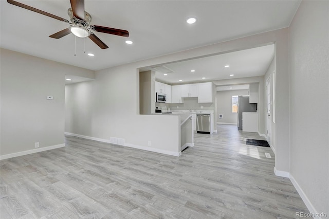 1216 Norwood Ave, Colorado Springs, CO 80905 - unfurnished living room with ceiling fan, light wood finished floors, and recessed lighting