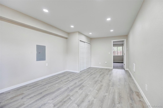 1216 Norwood Ave, Colorado Springs, CO 80905 - spare room featuring electric panel, light wood-type flooring, and recessed lighting