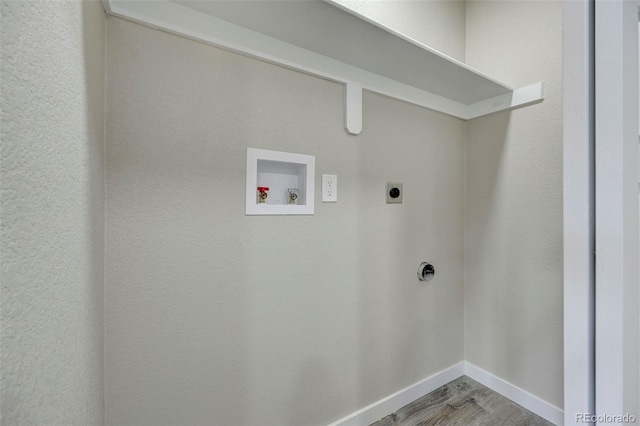 1216 Norwood Ave, Colorado Springs, CO 80905 - washroom featuring hookup for an electric dryer, hookup for a washing machine, and wood finished floors
