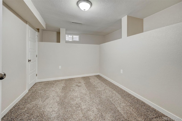 1216 Norwood Ave, Colorado Springs, CO 80905 - basement with a textured ceiling and carpet flooring
