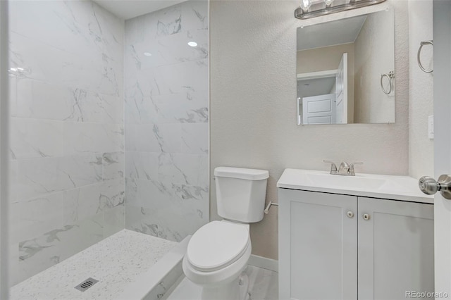 1216 Norwood Ave, Colorado Springs, CO 80905 - bathroom with vanity, tiled shower, and marble look tile flooring