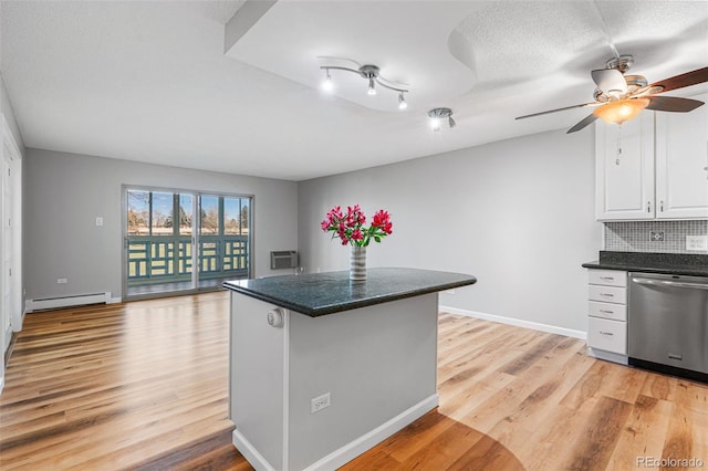 kitchen with light hardwood / wood-style flooring, tasteful backsplash, white cabinets, a baseboard radiator, and stainless steel dishwasher