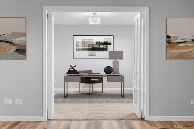 home office featuring hardwood / wood-style flooring