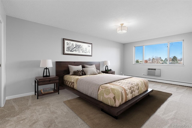 carpeted bedroom with a textured ceiling and a wall unit AC