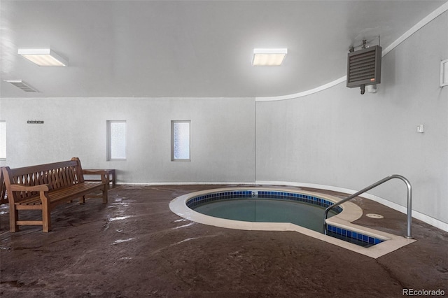 view of pool with an indoor hot tub