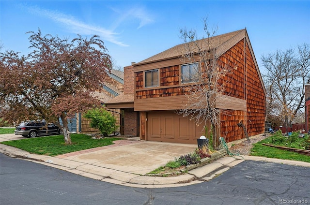 10102 W Ida Ave Unit 214, Littleton, CO 80127 - view of front of house with an attached garage, driveway, and a shingled roof