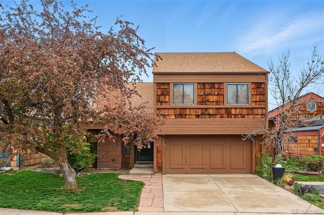 10102 W Ida Ave Unit 214, Littleton, CO 80127 - view of front of house with a garage, concrete driveway, and a shingled roof