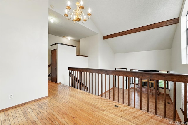 10102 W Ida Ave Unit 214, Littleton, CO 80127 - additional living space with a chandelier, wood-type flooring, and baseboards