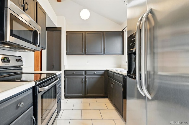 10102 W Ida Ave Unit 214, Littleton, CO 80127 - kitchen with stainless steel appliances, lofted ceiling, light countertops, light tile patterned flooring, and pendant lighting