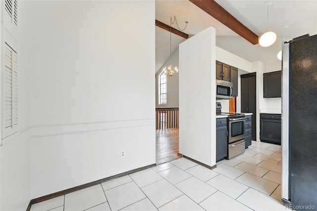 10102 W Ida Ave Unit 214, Littleton, CO 80127 - kitchen with stainless steel appliances, light countertops, hanging light fixtures, a chandelier, and baseboards