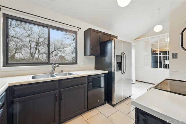 10102 W Ida Ave Unit 214, Littleton, CO 80127 - kitchen with black dishwasher, a sink, lofted ceiling, light countertops, and light tile patterned floors