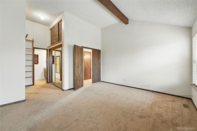 10102 W Ida Ave Unit 214, Littleton, CO 80127 - unfurnished bedroom featuring carpet, a textured ceiling, and baseboards
