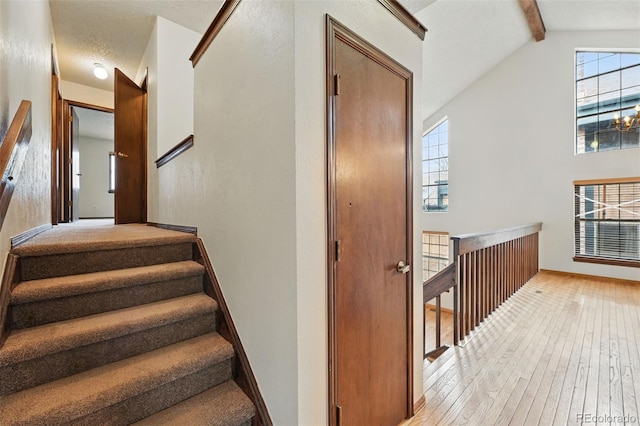 10102 W Ida Ave Unit 214, Littleton, CO 80127 - stairway featuring hardwood / wood-style floors, plenty of natural light, and baseboards