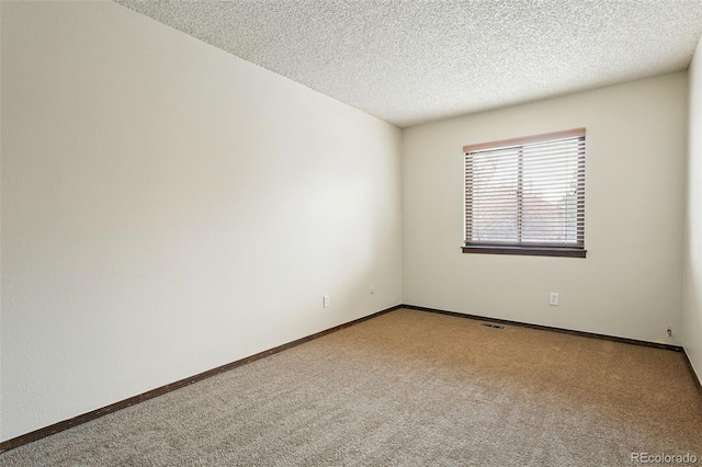 10102 W Ida Ave Unit 214, Littleton, CO 80127 - unfurnished room with carpet flooring, a textured ceiling, and baseboards