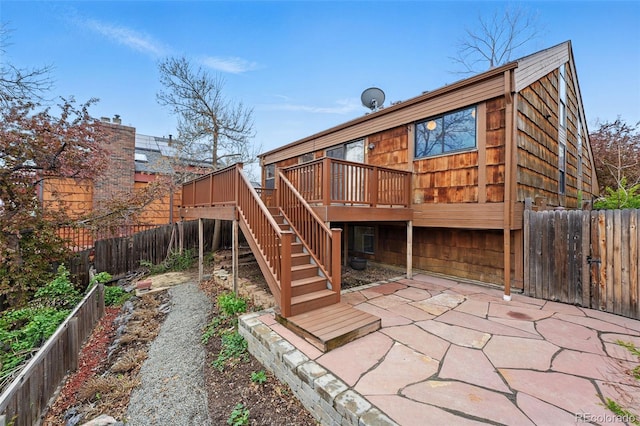 10102 W Ida Ave Unit 214, Littleton, CO 80127 - back of property with a wooden deck, a fenced backyard, a patio area, and stairway
