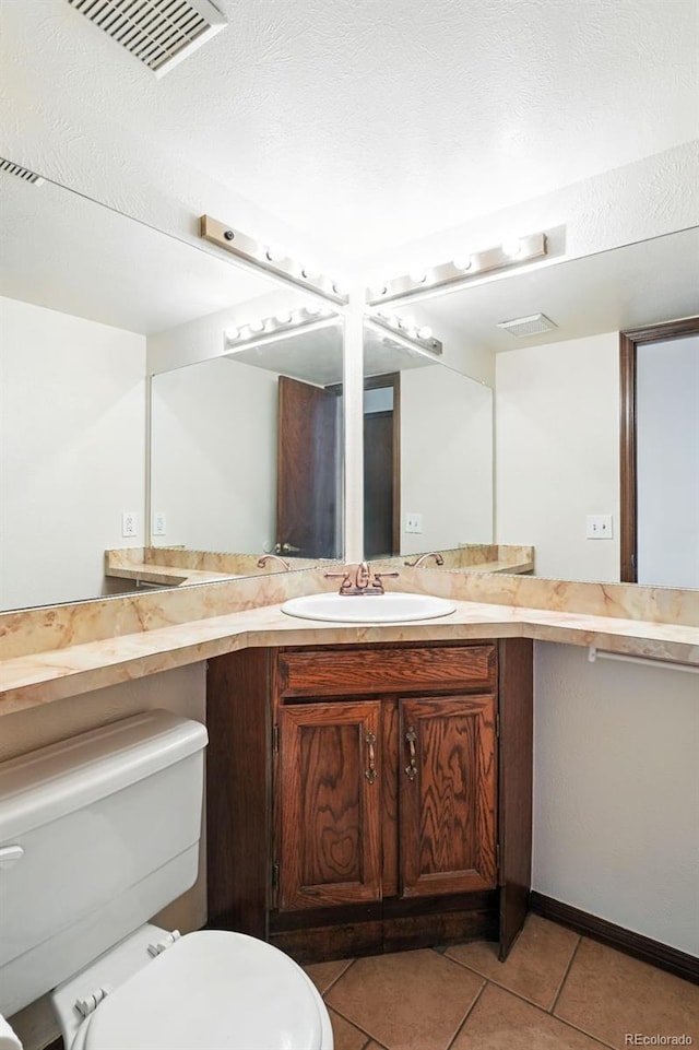 10102 W Ida Ave Unit 214, Littleton, CO 80127 - bathroom featuring toilet, tile patterned flooring, and vanity