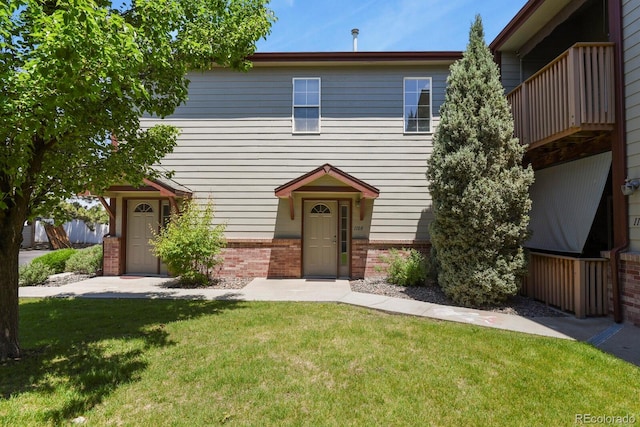 11085 Huron St Unit 1108, Northglenn, CO 80234 - townhome / multi-family property featuring brick siding and a front lawn