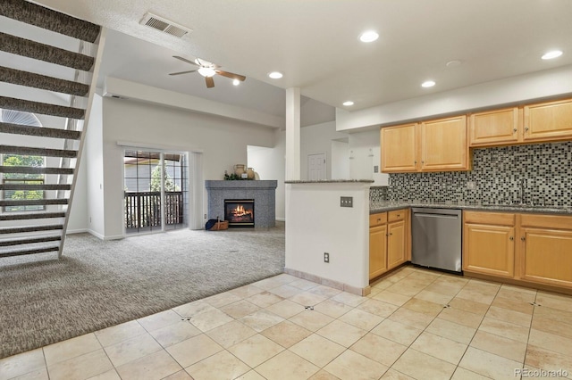 11085 Huron St Unit 1108, Northglenn, CO 80234 - kitchen with stainless steel dishwasher, light carpet, open floor plan, a ceiling fan, and light tile patterned flooring