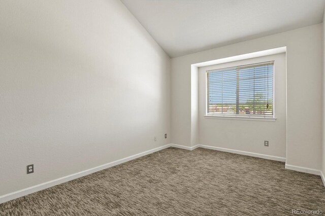 11085 Huron St Unit 1108, Northglenn, CO 80234 - carpeted empty room featuring vaulted ceiling and baseboards