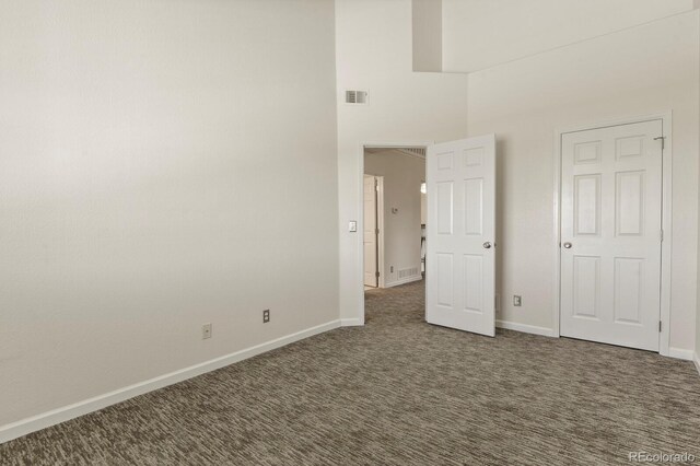 11085 Huron St Unit 1108, Northglenn, CO 80234 - unfurnished bedroom featuring a high ceiling and carpet