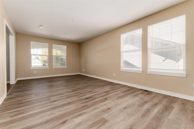 empty room with light wood-type flooring