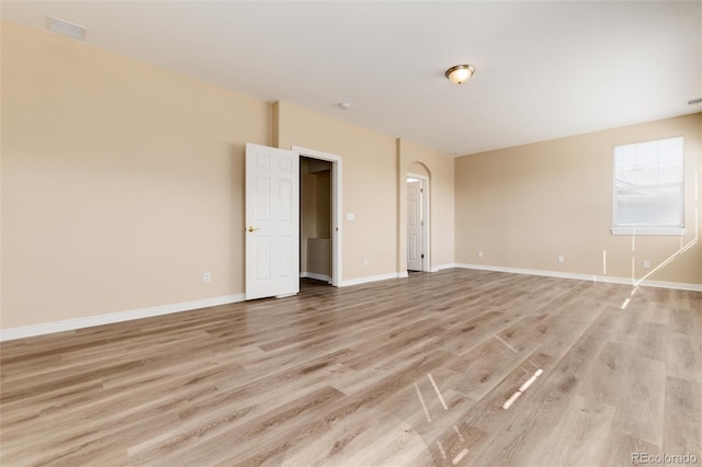 spare room featuring light hardwood / wood-style floors