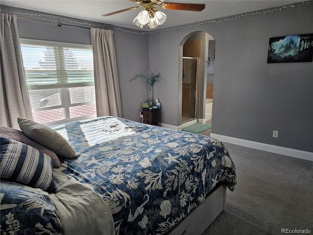 carpeted bedroom featuring ceiling fan and ensuite bath