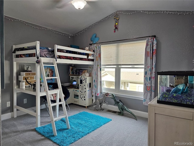 bedroom featuring carpet floors, vaulted ceiling, and ceiling fan