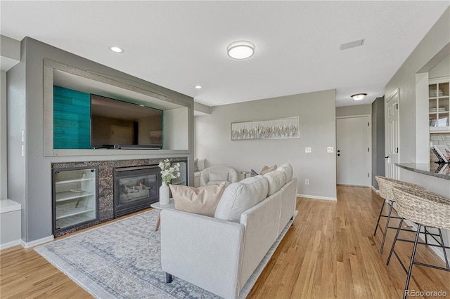 901 Sage Sparrow Cir, Highlands Ranch, CO 80129 - living area with light wood-style flooring, baseboards, a fireplace, and recessed lighting