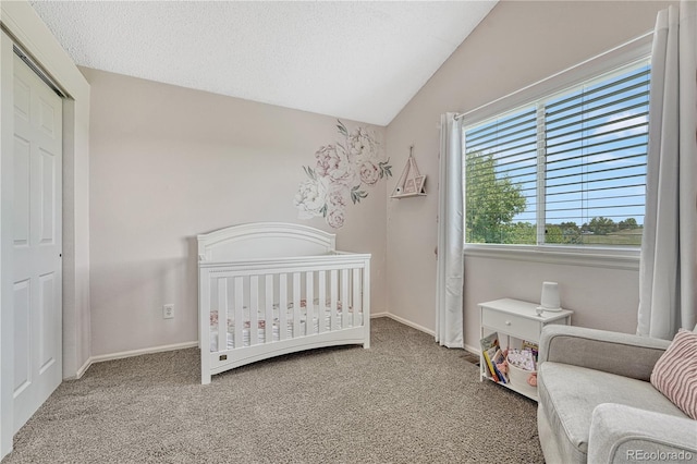 901 Sage Sparrow Cir, Highlands Ranch, CO 80129 - carpeted bedroom featuring vaulted ceiling, a nursery area, baseboards, and a closet