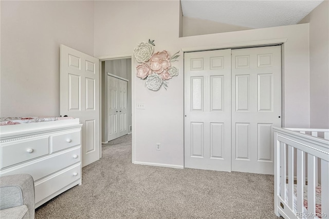901 Sage Sparrow Cir, Highlands Ranch, CO 80129 - unfurnished bedroom featuring carpet floors, a closet, a nursery area, and lofted ceiling