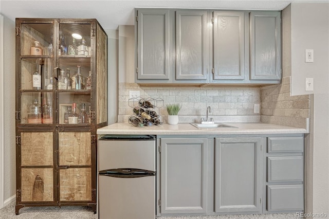 901 Sage Sparrow Cir, Highlands Ranch, CO 80129 - indoor wet bar featuring fridge and backsplash