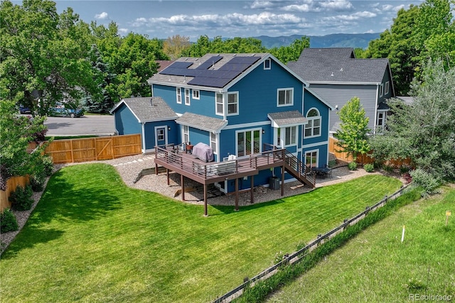 901 Sage Sparrow Cir, Highlands Ranch, CO 80129 - rear view of house featuring a wooden deck, solar panels, roof with shingles, and stairs
