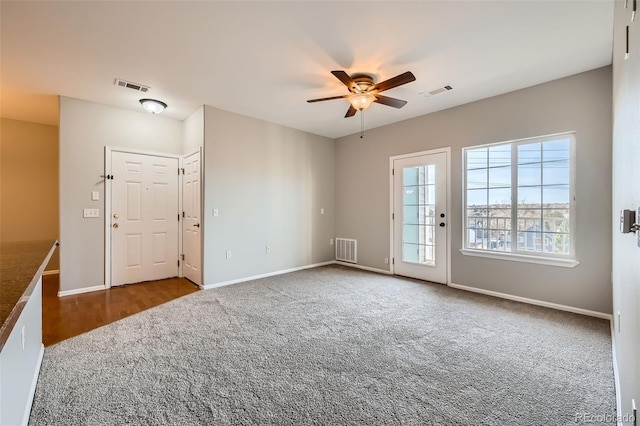 2705 S Danube Way Unit 306, Aurora, CO 80013 - unfurnished living room featuring carpet floors, a ceiling fan, and baseboards