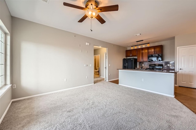 2705 S Danube Way Unit 306, Aurora, CO 80013 - kitchen featuring black appliances, carpet flooring, ceiling fan, and backsplash