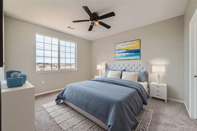 2705 S Danube Way Unit 306, Aurora, CO 80013 - bedroom with baseboards, light colored carpet, and a ceiling fan