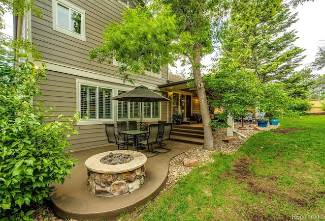 view of patio with a fire pit