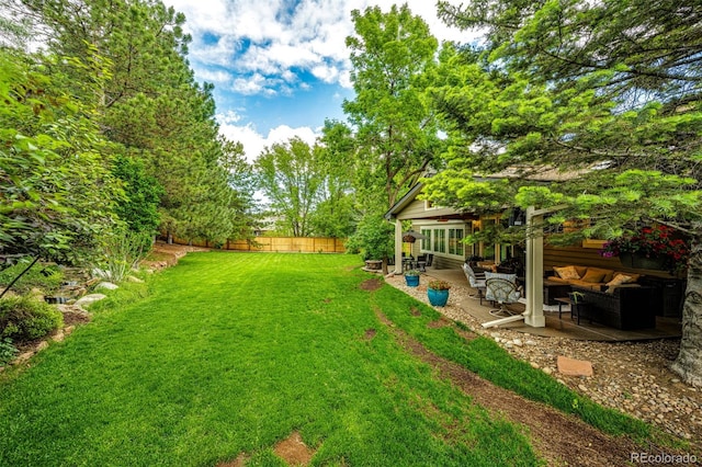 view of yard featuring fence private yard and a patio area